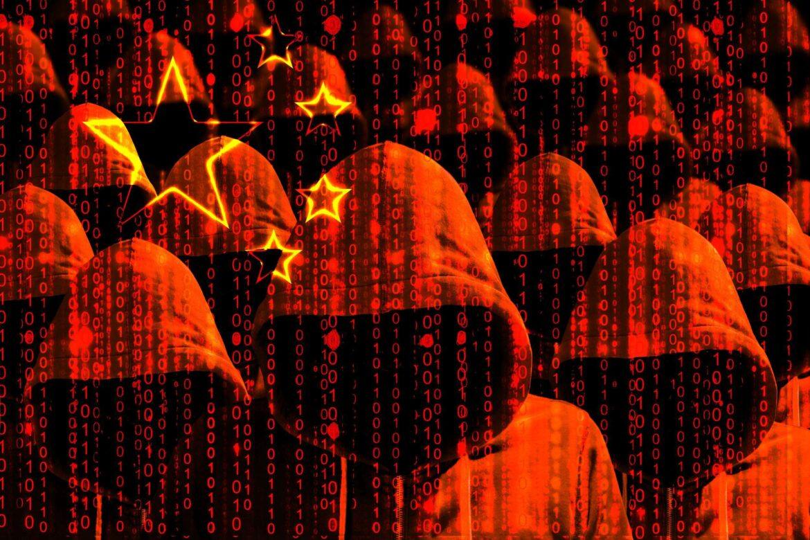 Group,Of,Hooded,Hackers,Shining,Through,A,Digital,Chinese,Flag