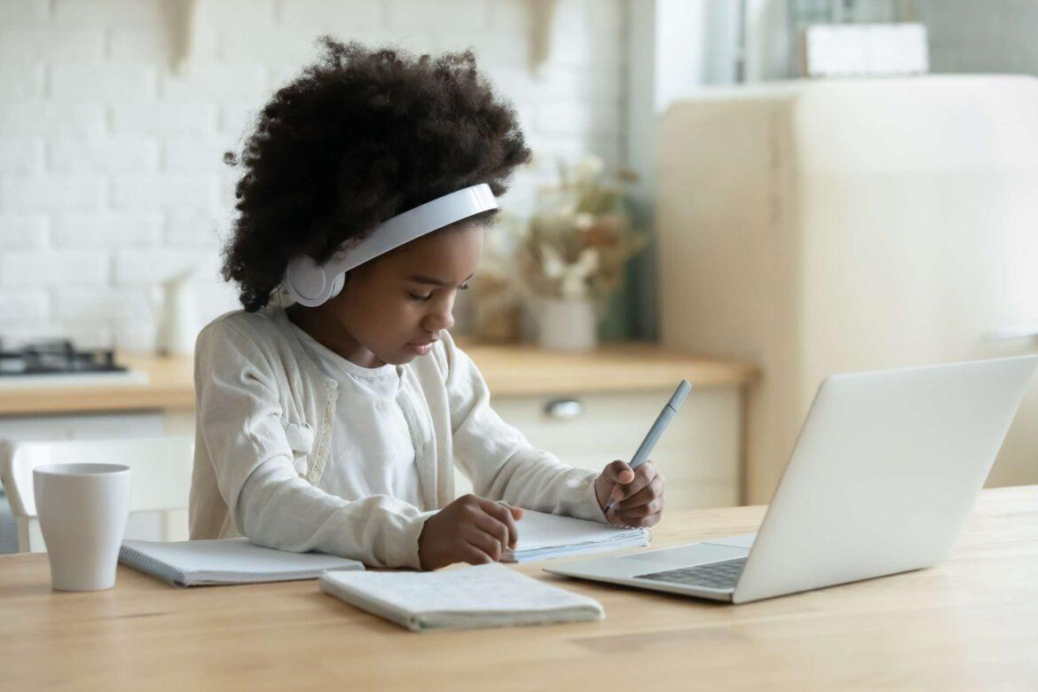 In,Kitchen,Schoolgirl,Do,Homework,,Focused,Little,African,Girl,Wear